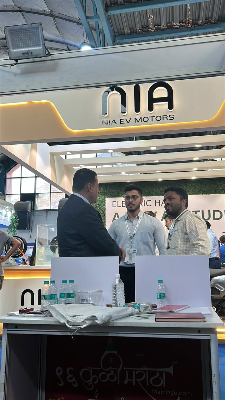 On-ground conversation at the NIA EV Motors expo booth